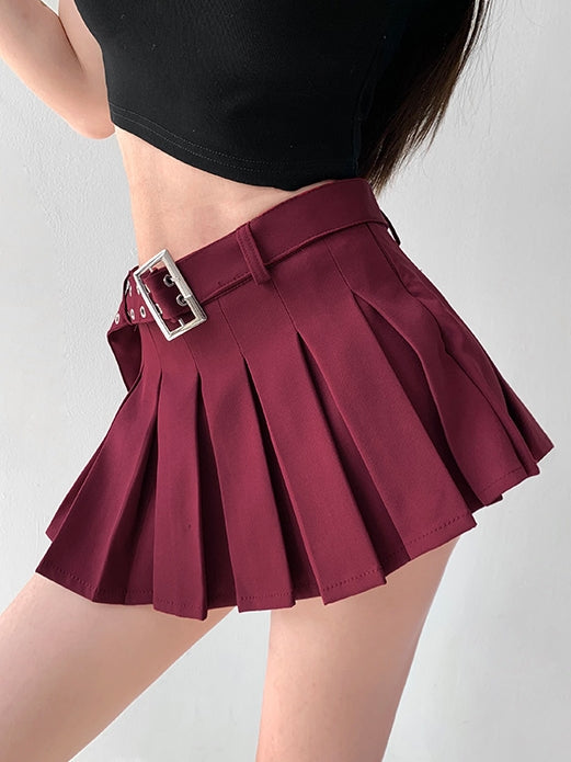 Maroon pleated skirt with a belt on a plain background