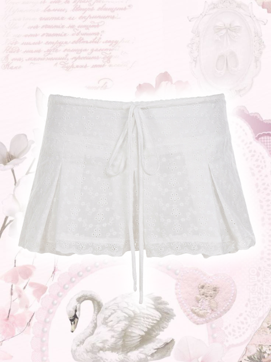 White shorts on a floral background with pink flowers and a swan.