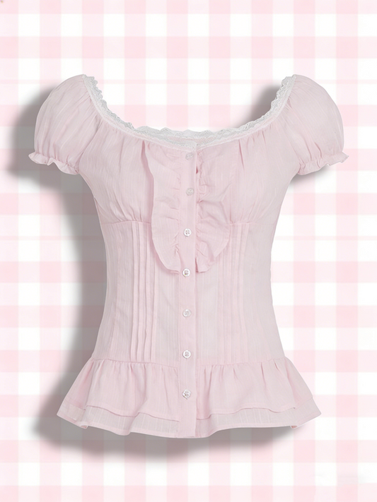 Pink blouse with ruffled sleeves on a pink checkered background